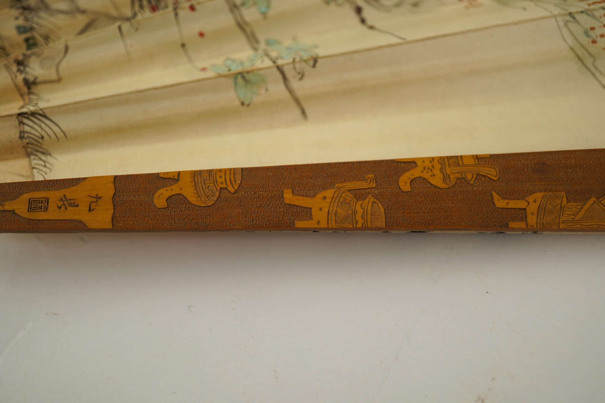 Two Chinese inscribed paper leaf fans, late 19th century